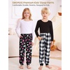 image:imageSWOMOG Unisex Kids Plaid Pajama pants for Boys amp Girls Comfy Sleepwear Bottoms Lounge Jogger PJ Pants with PocketsBlack Colorful Dinosaur